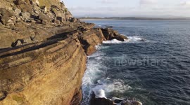 Aerial view of a cliff located in Asturias, Spain. Famous for bouldering and fishing. Nice place to scape from coronavirus social distance.