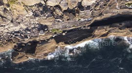 Aerial view of a cliff located in Asturias, Spain. Famous for bouldering and fishing. Nice place to scape from coronavirus social distance.