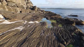 Aerial view of a cliff located in Asturias, Spain. Famous for bouldering and fishing. Nice place to scape from coronavirus social distance.