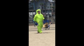 Man seen wearing inflatable bodysuit on beach in California during COVID-19 pandemic
