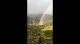 Both ends of double rainbow caught on camera from mountaintop in Vietnam