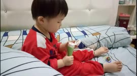 Adorable 2-year-old tries to put sleeping mask on face before off to sleep