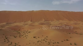 Low level pass over large sand dunes