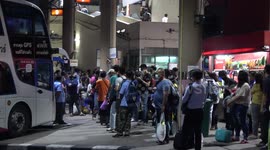 Crowds fill bus stations in Bangkok for weekend holiday getaway as lockdown eases