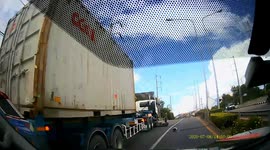 Motorcyclist inches from being crushed after crashing with lorry in Thailand