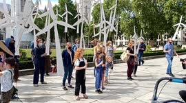 Parents create a human wind-farm outside Downing Street to tackle climate change