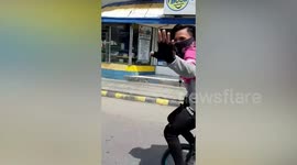 Out-of-work acrobat delivers food on unicycle during pandemic in the Philippines