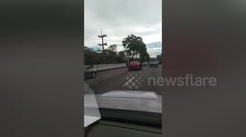Taxi carries motorbike on the passenger seats