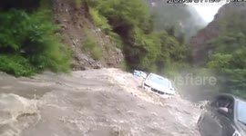Ferocious mountain flood traps 153 people and 45 vehicles in southern China