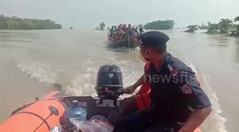 District officials rescue villagers stranded in overburdened boat amid embankment breach in northern India