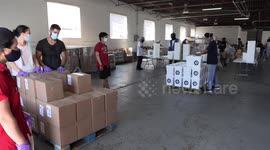 Volunteers in Toronto prepare food for those affected by COVID-19
