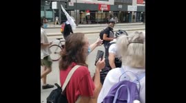 Protesters ask police officers to wear masks during Chicago rally