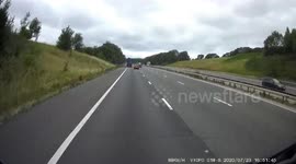 HGV Truck Lane wandering nearly wipes out a car on the hard shoulder and a woman checking on her child in the rear.