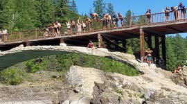 Man pulled to safety after knocking himself out jumping from bridge in Montana's Rocky Mountains