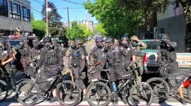 Seattle police officer uses bike to hit protester during push back