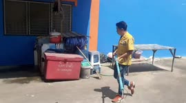 Monitor lizard caught after hiding under car bonnet in Thailand