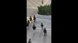 Police in riot gear assemble to face off with protesters