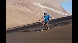 Sandboarder rides epic and spectacular dunes in the Chilean Desert