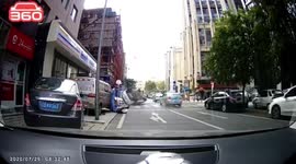 Pedestrian knocked over after car clips vehicle in front on northern Chinese road