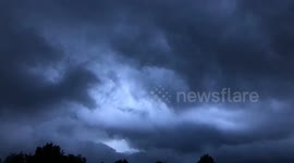 Fast moving storm clouds blow in the wind- time lapse