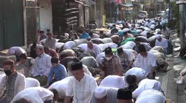 Hundreds of Muslims perform Eid Al-Adha prayers on Jakarta road