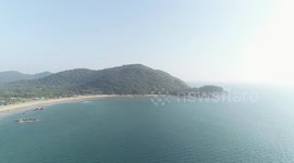 Drone shot of beautiful beach and mountain