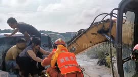 Firefighters rescue 14 passengers from minibus sliding into a river in southern China