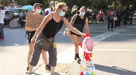 Demonstrators punch Trump inflatable before anti-fascist march in NYC