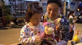 Thai girl likes a dancing doll