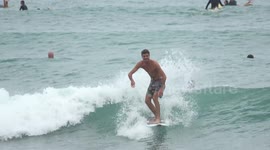 Dozens of South Florida surfers ride Tropical Storm Isaias waves