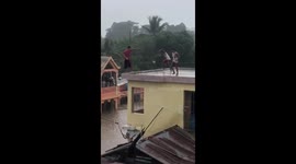 A kid jumping from second floor to a flooded street