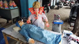 The artistes took to make the idol of Lord Ganesha (Hindu God Resembling with the head of an elephant) in the shape of Doctor ahead of the Indian Festival Ganesh Chaturthi in Bengaluru, Karnataka in Southern India.