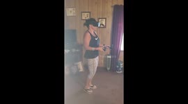 Old lady playing vertical reality game