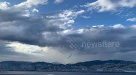 Planes flying over Genoa and launching the colors of the Italian flag