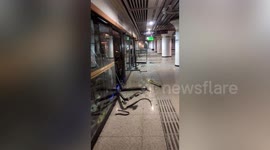 Construction vehicle crashes into Chinese train station, smashes row of platform doors