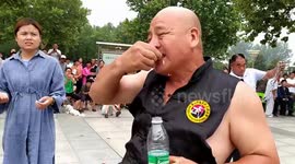 Chinese man shows off incredible kung fu skills by eating glass and nails