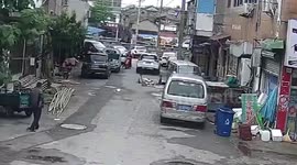 Chinese children playing in cardboard boxes luckily survive being run over by car