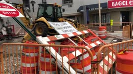 Construction barrier blown over by high winds and rain from Hurricane / Tropical Storm Isaias in NYC