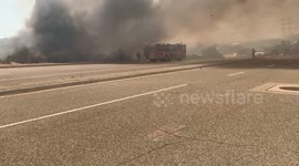 Helicopter Rescues Firefighters battling blaze!