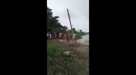 Two Indian villagers swept away by floodwater after the earth they were standing on gives way