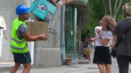 Practical joker terrifies passers-by with falling boxes prank