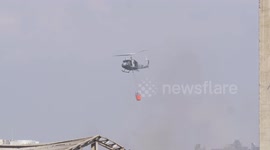 Helicopters put out fire at the scene of Beirut port explosion