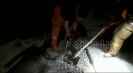 Firefighters evacuate a 2 meter long python trapped in a water channel