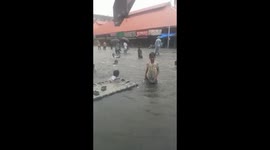 Children play in floodwater as heavy rain causes havoc in Mumbai