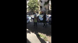 People Cleaning the streets and helping each other after the explosion