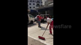 Beirut civilians line streets armed with brooms as cleanup operations begin