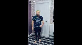 Dad using glow sticks to perform funny dance
