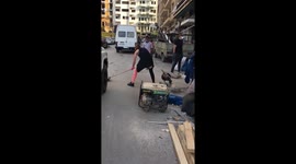 Men and woman cleaning and helping however they can