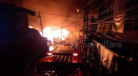 A large fire burned a traditional market in the middle of a densely populated settlement in Indonesia