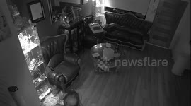 Ghost caught on home camera - look through front door